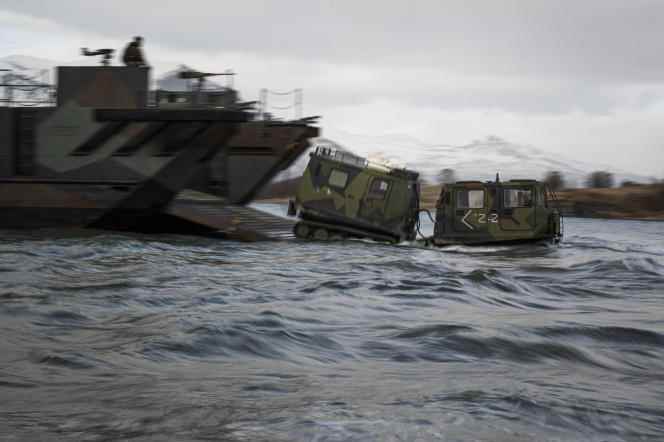 Snowcats from the 3rd Battalion, 6th U.S. Marine Regiment deploy from Royal Netherlands Navy landing craft as they take part in the international military exercise Cold Response 22, in Sandstrand, Norway, March 21, 2022. 