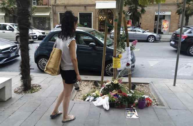 Flowers and tributes were left by passers-by, July 30, 2022, where Alika Ogorchukwu was beaten to death, in Civitanova Marche, Italy.