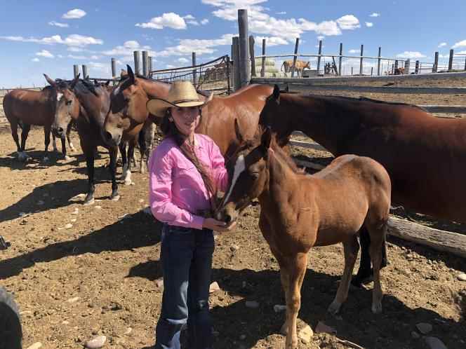 Taylor, 13, daughter of Laurie Thoman, and her horses, at the Thoman ranch in Wyoming, July 20, 2022.