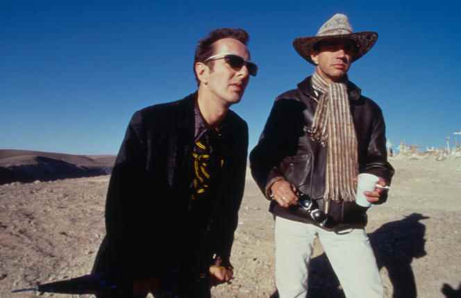Joe Strummer, frontman of The Clash, and filmmaker F. J. Ossang on the set of “Doctor Luck” (1997).