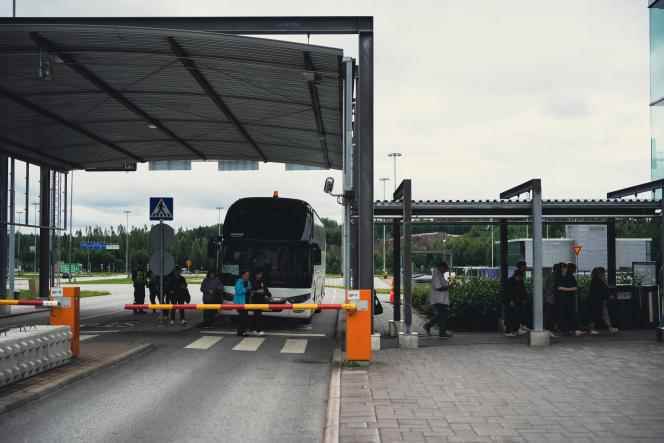 Russian tourists arrive by bus at the Nuijamaa border crossing in Finland on July 28, 2022.