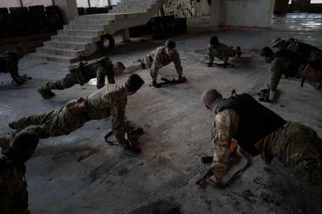 Young recruits from the Lubart Battalion take part in training in an abandoned Soviet building in Ukraine on March 20, 2022.