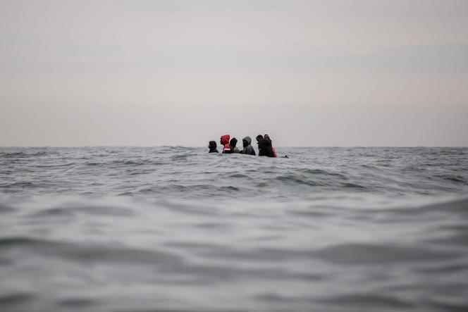 Migrants aboard a boat navigating rough waters between Sangatte and Cape Blanc-Nez in the English Channel as they attempt to cross the maritime border between France and the United Kingdom on August 27, 2020.