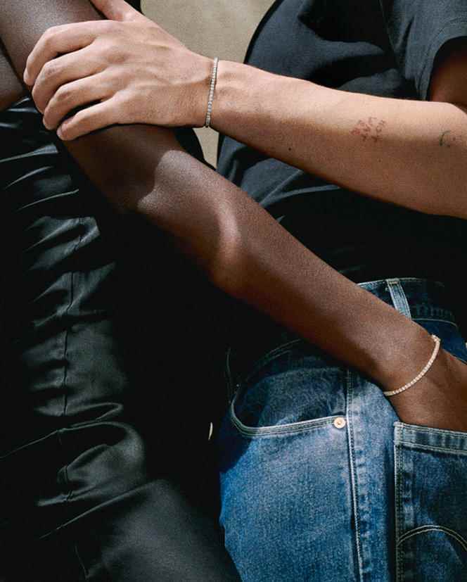 Bracelets, Tu es ma rivière d'amour, one in white gold and diamonds, the other in yellow gold and diamonds, Mauboussin, €3,295;  dress, Refine;  t-shirt, Maison Standards;  jeans, Levi's.