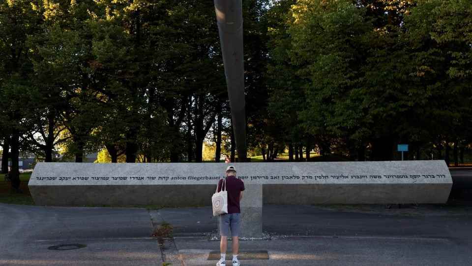 A man stands in front of the memorial to the attack during the 1972 Olympic Games.