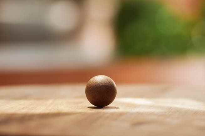 The coffee balls are surrounded by a protective layer that is fully compostable.