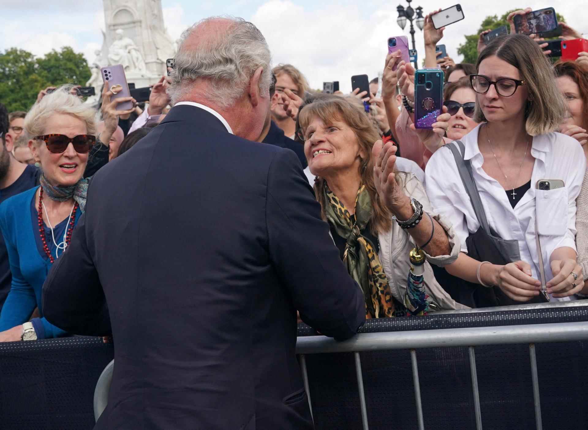   Charles III greets the crowd for a moment in front of Buckingham Palace in London on September 9, 2022.