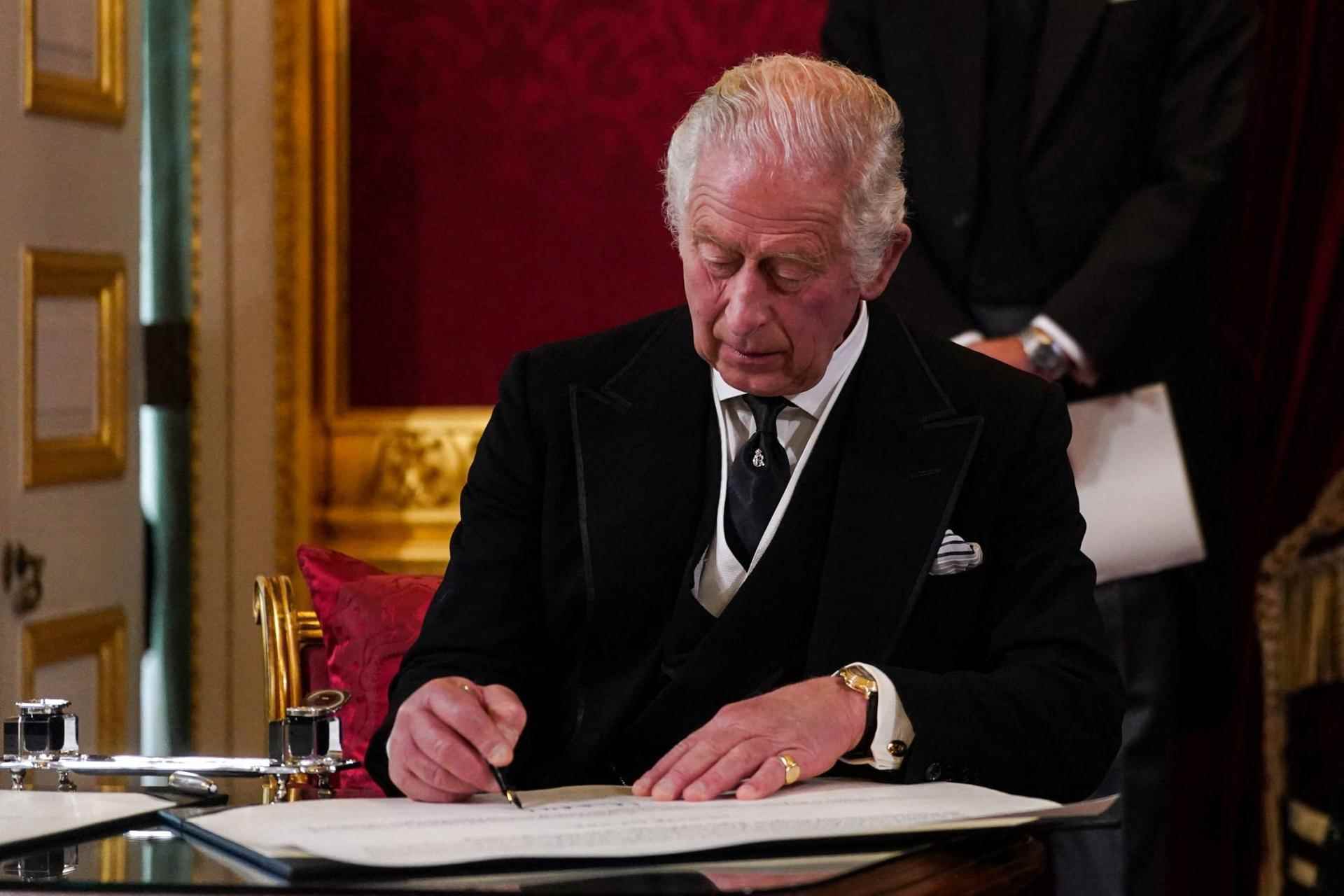 Charles III signs an oath pledging him to provide security for the Anglican Church of Scotland, during the Accession Council meeting proclaiming his arrival to the throne, at St. James's Palace, London, September 10 2022.