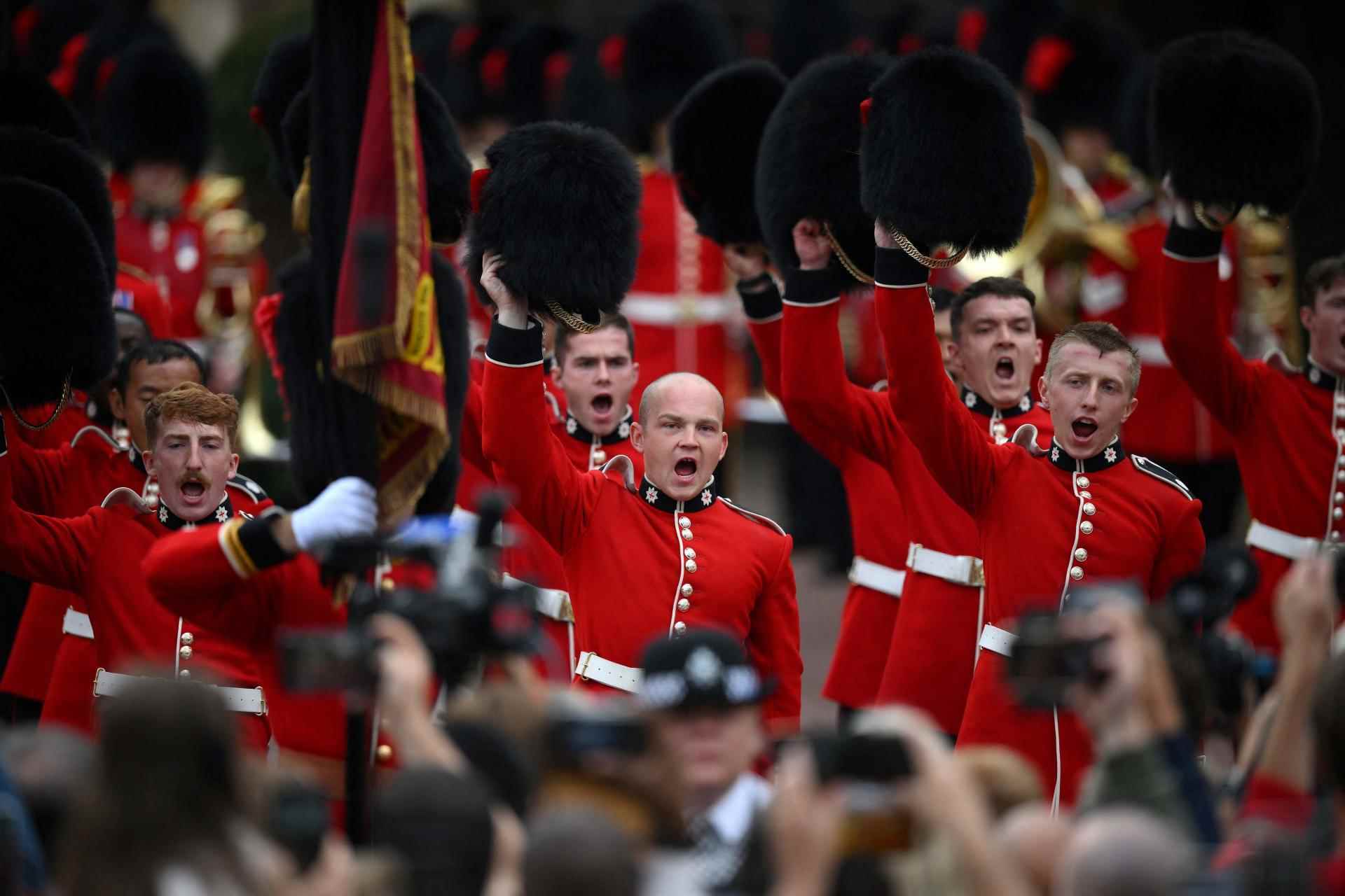 Members of the Coldstream Guards raise their hats to greet the new King, in Friary Court at St James's Palace in London, September 10, 2022.