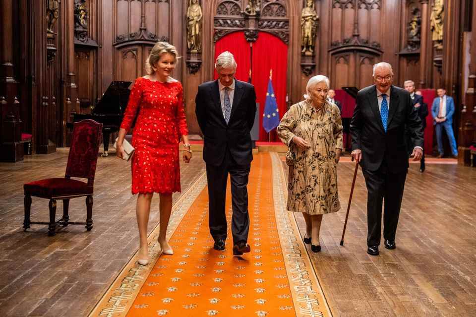 Queen Mathilde in a red lace dress