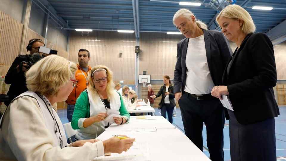 Woman in front of the voters' table.