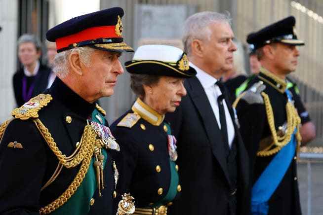 The Queen's four children walk behind the coffin: King Charles III, Princess Anne, Prince Andrew and Prince Edward (from left).