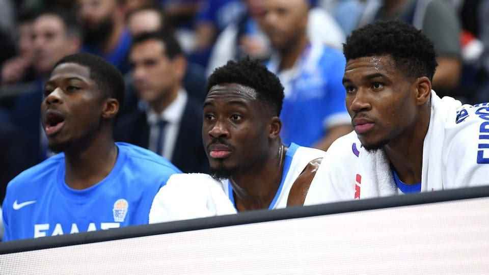 Thanassis, Giannis and Kostas Antetokounmpo on the bench during a national team match.