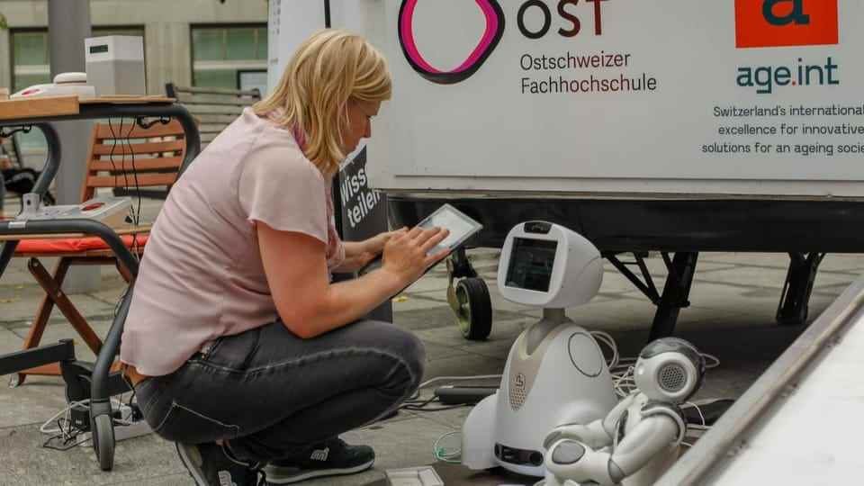 Woman programming robot