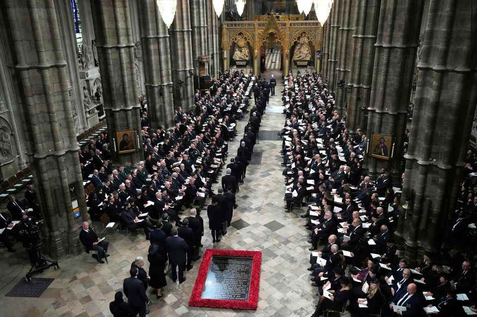 Mourners take their seats in Westminster Abbey.