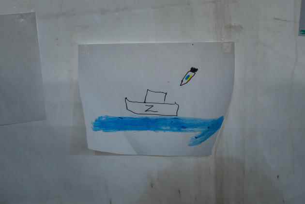 A child's drawing hangs in a tent at the reception center for displaced people fleeing Russian-occupied regions, in Zaporizhia, Ukraine, September 23, 2022. 