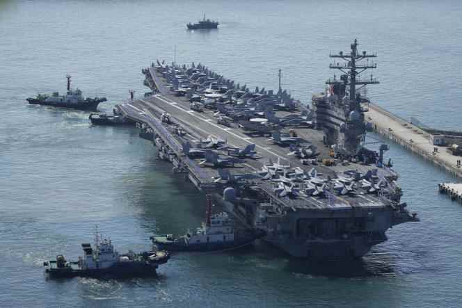 The US aircraft carrier 'USS Ronald Reagan' escorted as it arrives in Busan, South Korea, September 23, 2022.