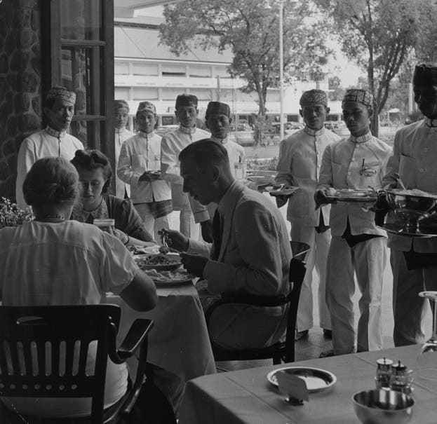Dutch people dine in a restaurant in Java, circa 1940.  