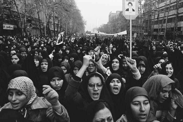 Women take part in a demonstration against the Shah in Tehran in December 1978. 