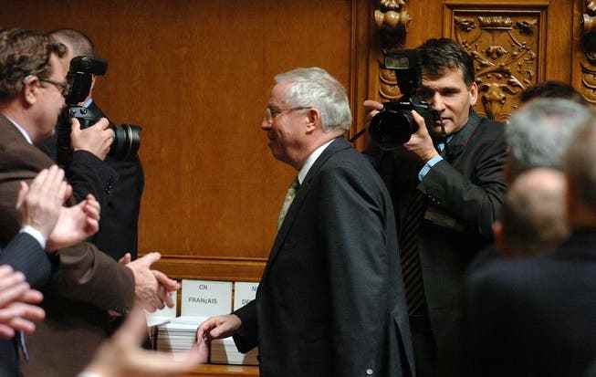 The voted-out Federal Councilor Christoph Blocher leaves the National Council chamber on December 13, 2007 after his farewell speech.