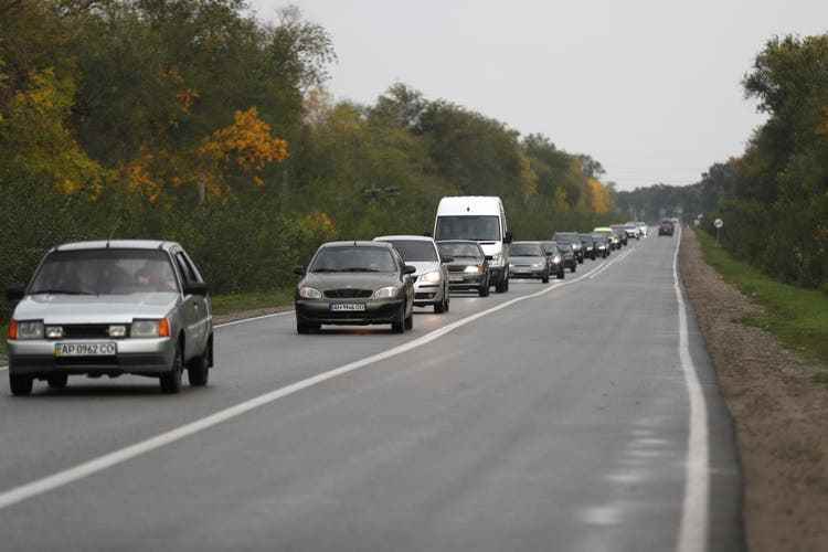 Ukrainian civilians leave Russian-held Zaporizhia Oblast with a police escort after a convoy was hit by a Russian missile.  At least 23 people were killed.