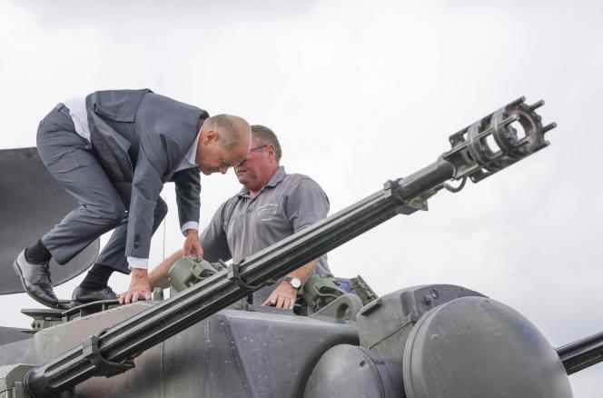 German Chancellor Olaf Scholz on a 'Gepard' anti-aircraft tank during his visit to a training program for Ukrainian soldiers at the military training base in Putlos, Germany, August 25, 2022.