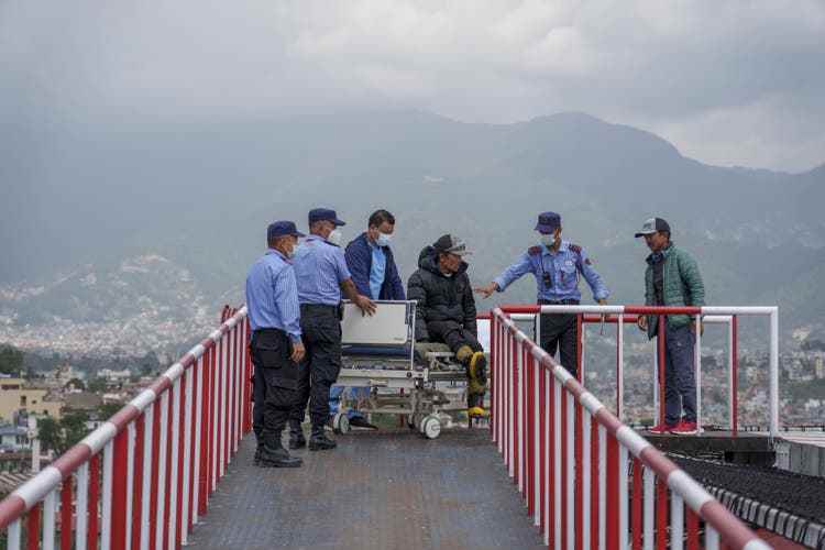 Two Sherpas who survived an avalanche on Manaslu are rushed to a hospital in Kathmandu on September 27.