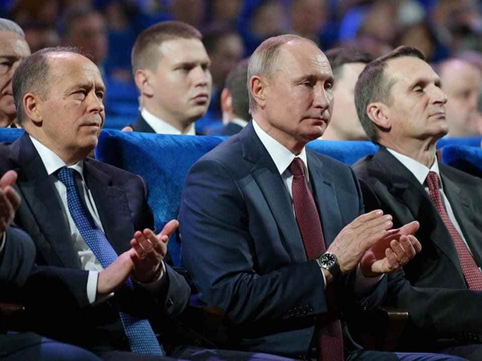 (left to right) Vladimir Putin, FSB chief Alexander Bortnikov and the head of the foreign intelligence service Sergei Naryshkin