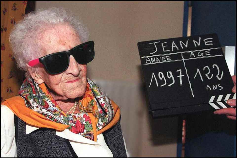 Jeanne Calment poses for the press one day before her 122nd birthday  