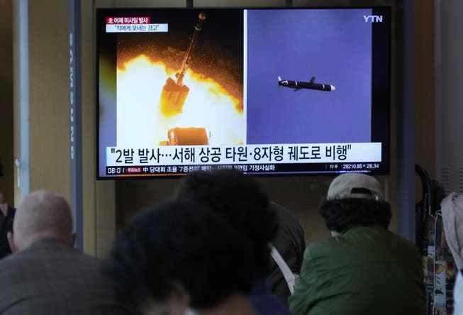 Images of the North Korean missile launch are shown on a TV screen during a news broadcast at the train station in Seoul, South Korea, Thursday, October 13, 2022.