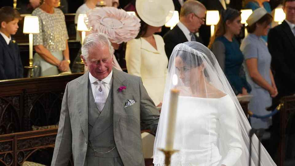Prince Harry, Prince Charles and Duchess Meghan at their wedding in 2018.
