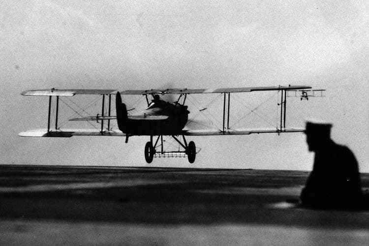 A VE-7 takes off from the aircraft carrier Langley in 1927.  A biplane of this type had made its first launch five years previously.