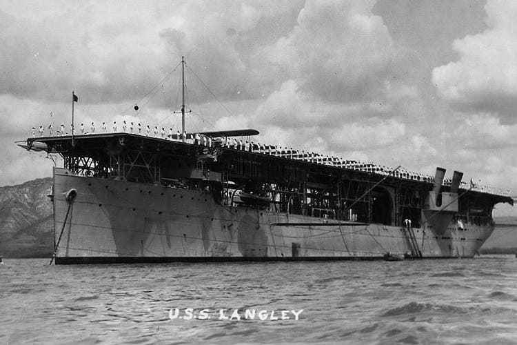 The «Langley» off Haiti in the spring of 1927.  The first aircraft carrier was created by installing a landing pad on an existing transport ship.