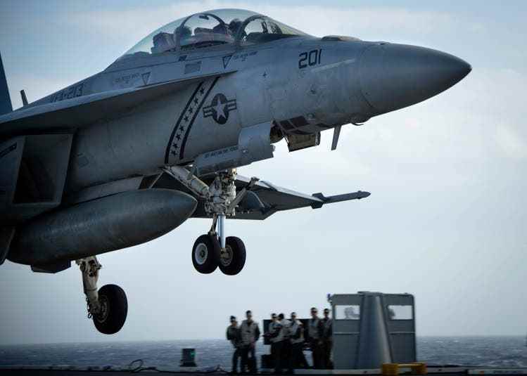 An F/A-18F landing on the most modern aircraft carrier in the USA, the 