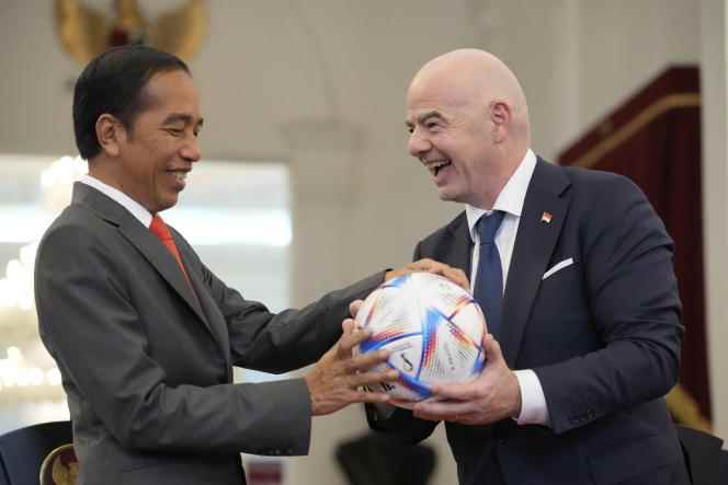 Indonesian President, Joko Widodo, on the left, receives a gift ball from FIFA President Gianni Infantino during their meeting on Tuesday, October 18, 2022.