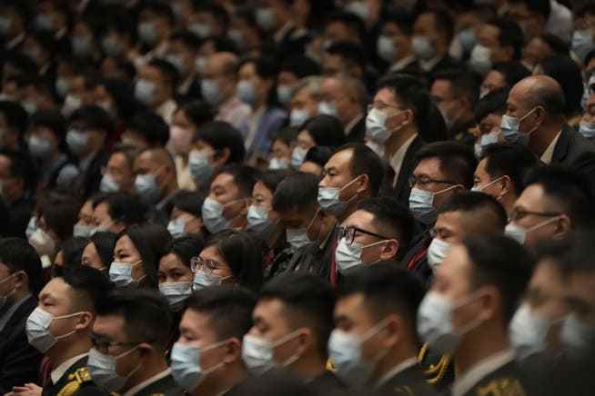 Delegates wearing face masks during the opening ceremony of the party congress in Beijing. 