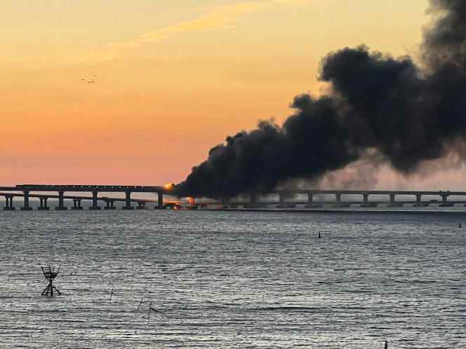 The fire on the bridge in Crimea, October 8, 2022 in a photo released by the Russian state news agency TASS. 