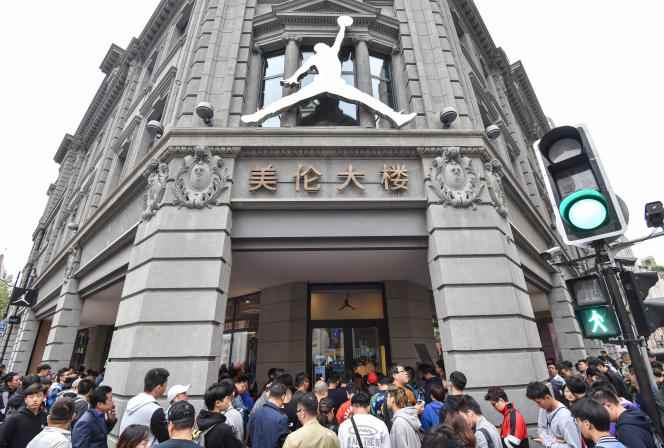 On October 26, 2019, customers wait outside a Nike store to buy the new Nike sneaker in Shanghai.