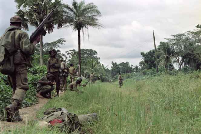 Members of Ulimo patrol the area in search of members of the National Patriotic Front of Liberia, October 27, 1992, north of Monrovia.