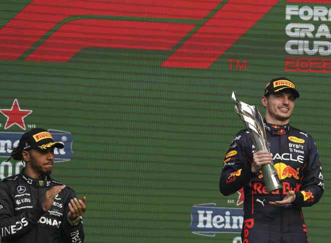 Mercedes driver Lewis Hamilton applauds Red Bull driver Max Verstappen's victory at the Formula One Mexican Grand Prix in Mexico City on October 30, 2022.