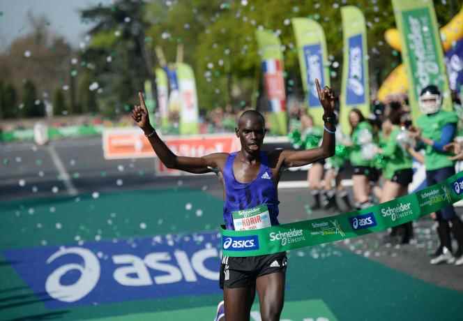 Runner Mark Korir at the finish of the 39th Paris Marathon in 2015.