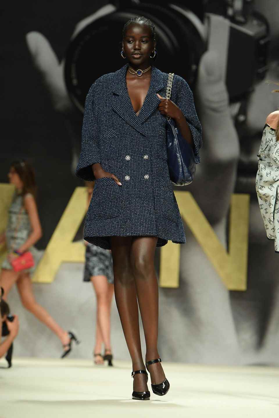 Model at Chanel show wears tweet blazer as total look