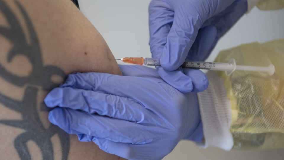 A person is vaccinated against the monkeypox virus.