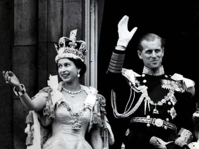Queen Elizabeth II and Prince Philip wave at the Queen's coronation.