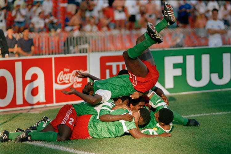 The Cameroonians celebrate Milla's second goal against Colombia in the 1990 World Cup round of 16 and win 2-1 in the end.