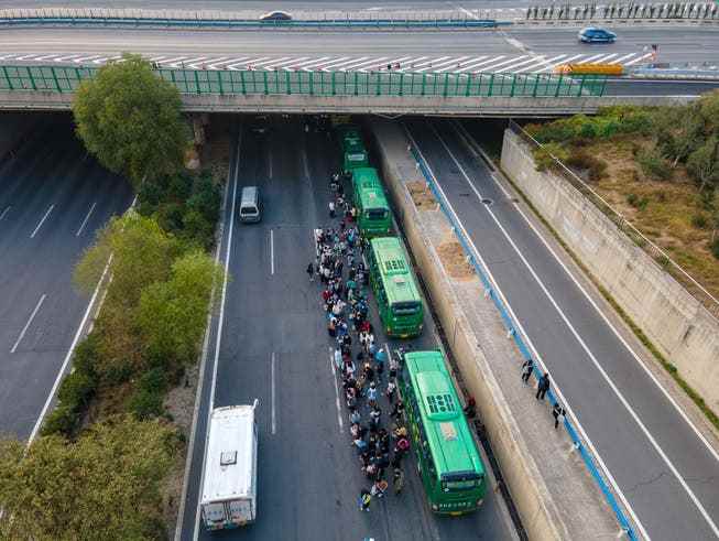 Shuttle buses bring Foxconn employees back to their hometowns after a Covid outbreak in Zhengzhou at the end of October.