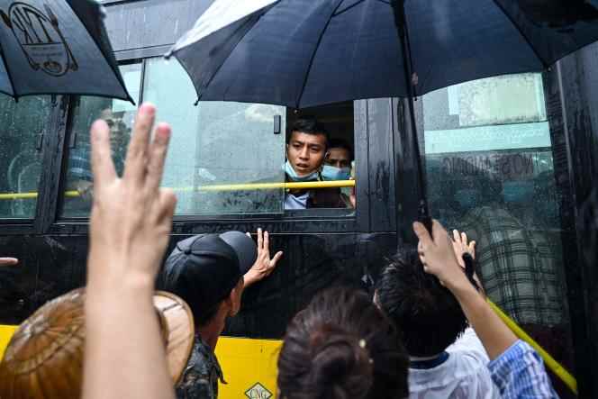A bus carrying pardoned prisoners outside Insein prison in Yangon on November 17, 2022. 