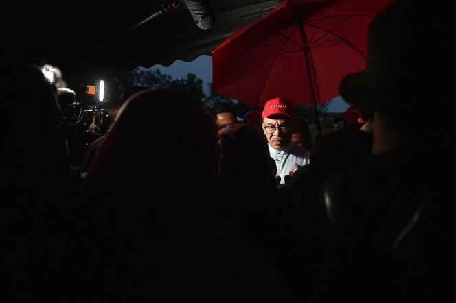 Malaysian opposition leader and Pakatan Harapan (Alliance of Hope) chairman Anwar Ibrahim speaks to the press during an election campaign rally in Ipoh, Malaysia's Perak state, November 18, 2020.