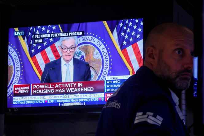 A trader reacts to US Federal Reserve Chairman Jerome Powell's announcement to raise interest rates, at the New York Stock Exchange, November 2, 2022.  