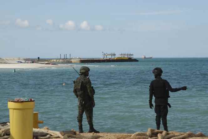 Rwandan soldiers stand guard outside Total's gas project in Afungi, Mozambique, September 29, 2022.